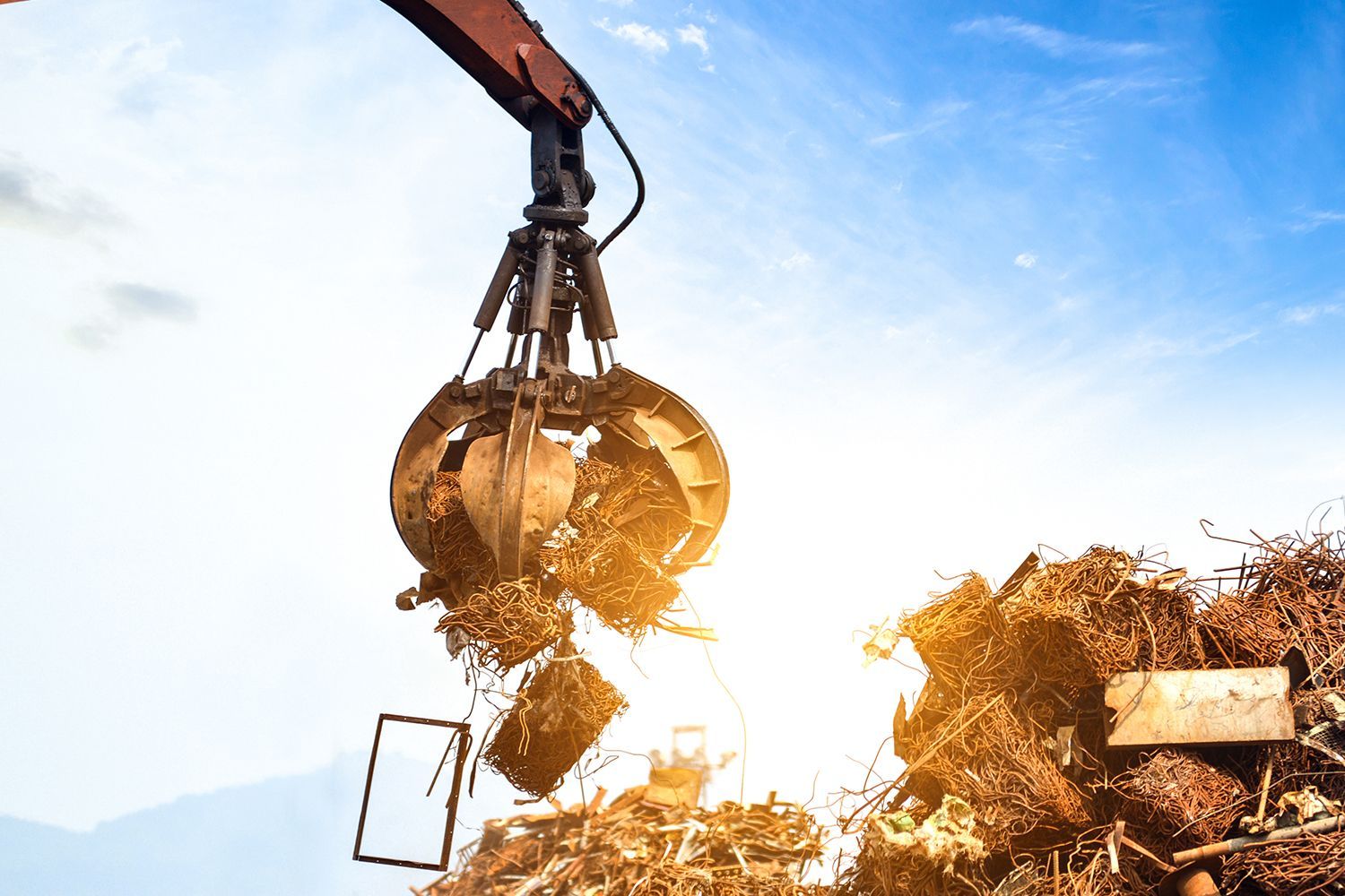 Cranes grab scrap for quick loading and smooth handling in active scrap yards.
