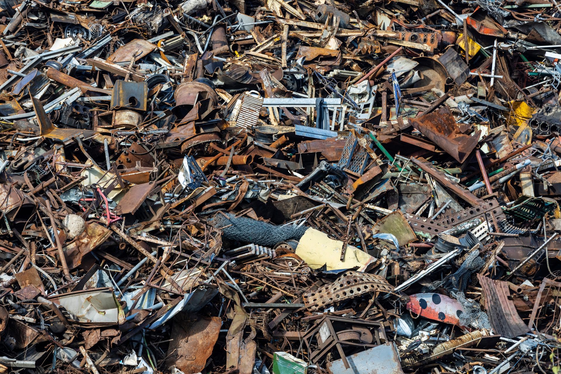 Close-up of unsorted scrap metal for recycling