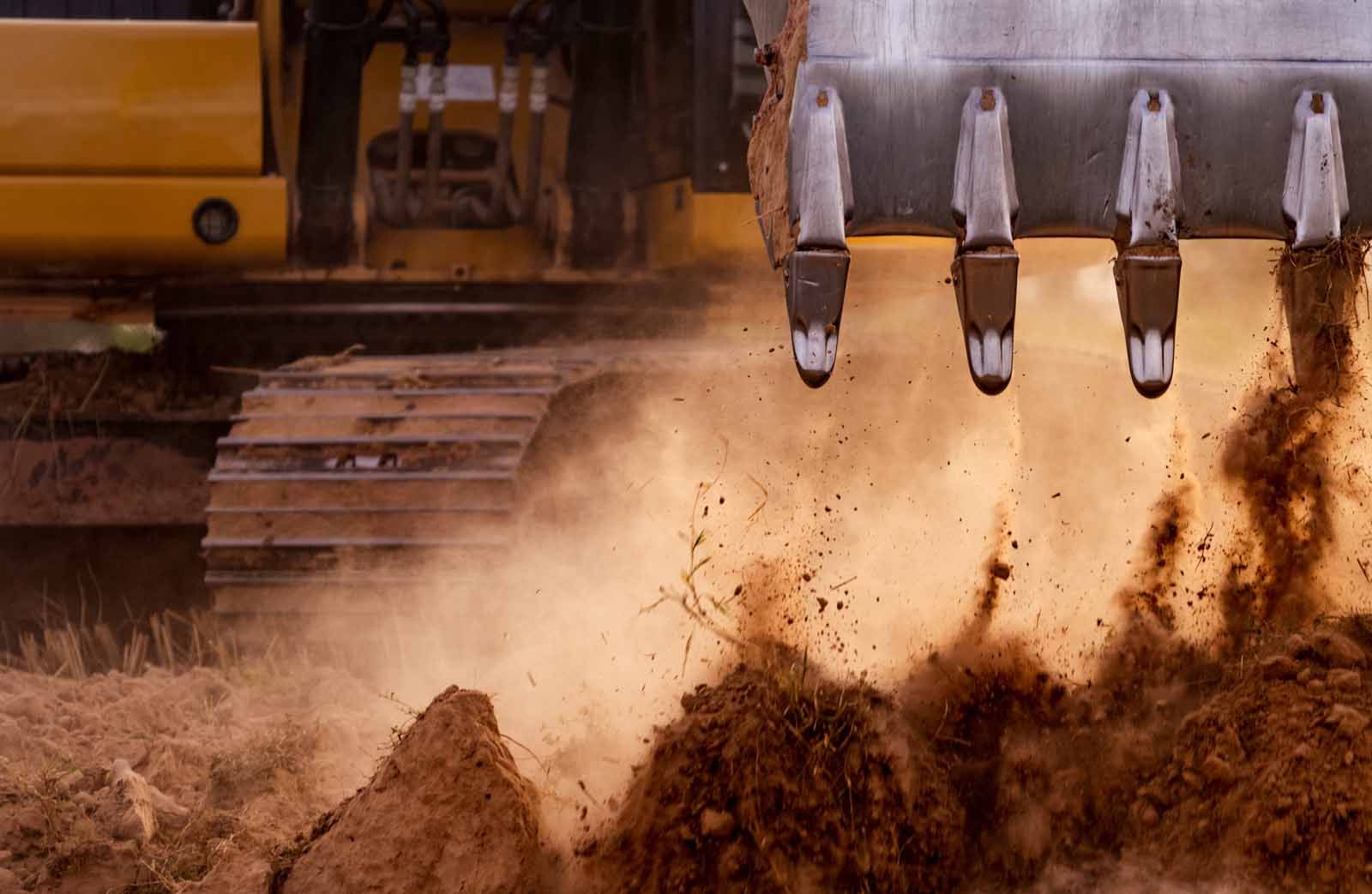 A bulldozer is moving dirt on a construction site.