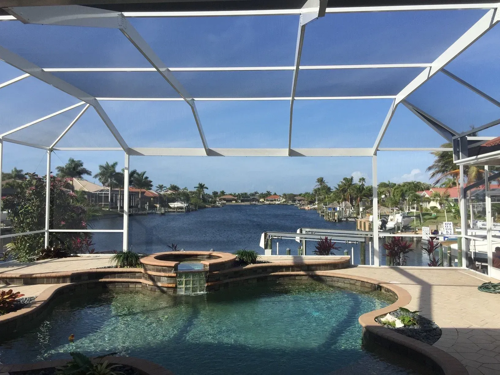 A swimming pool with a view of a body of water