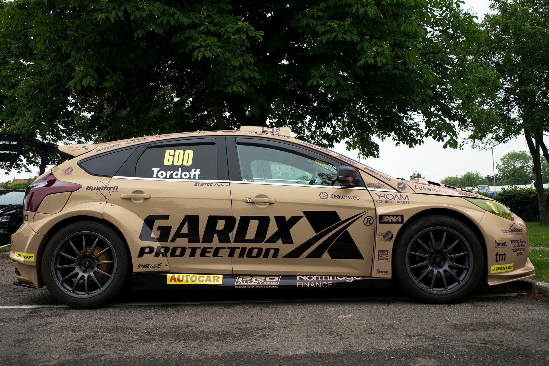 A garox protection car is parked in a parking lot