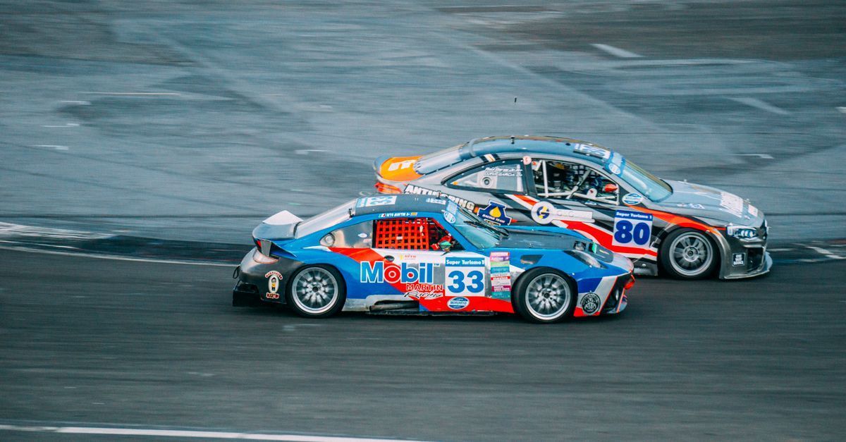Mikey Doble and Matt Parkes shake hands to launch Doble Motorsport at the MINI Challenge