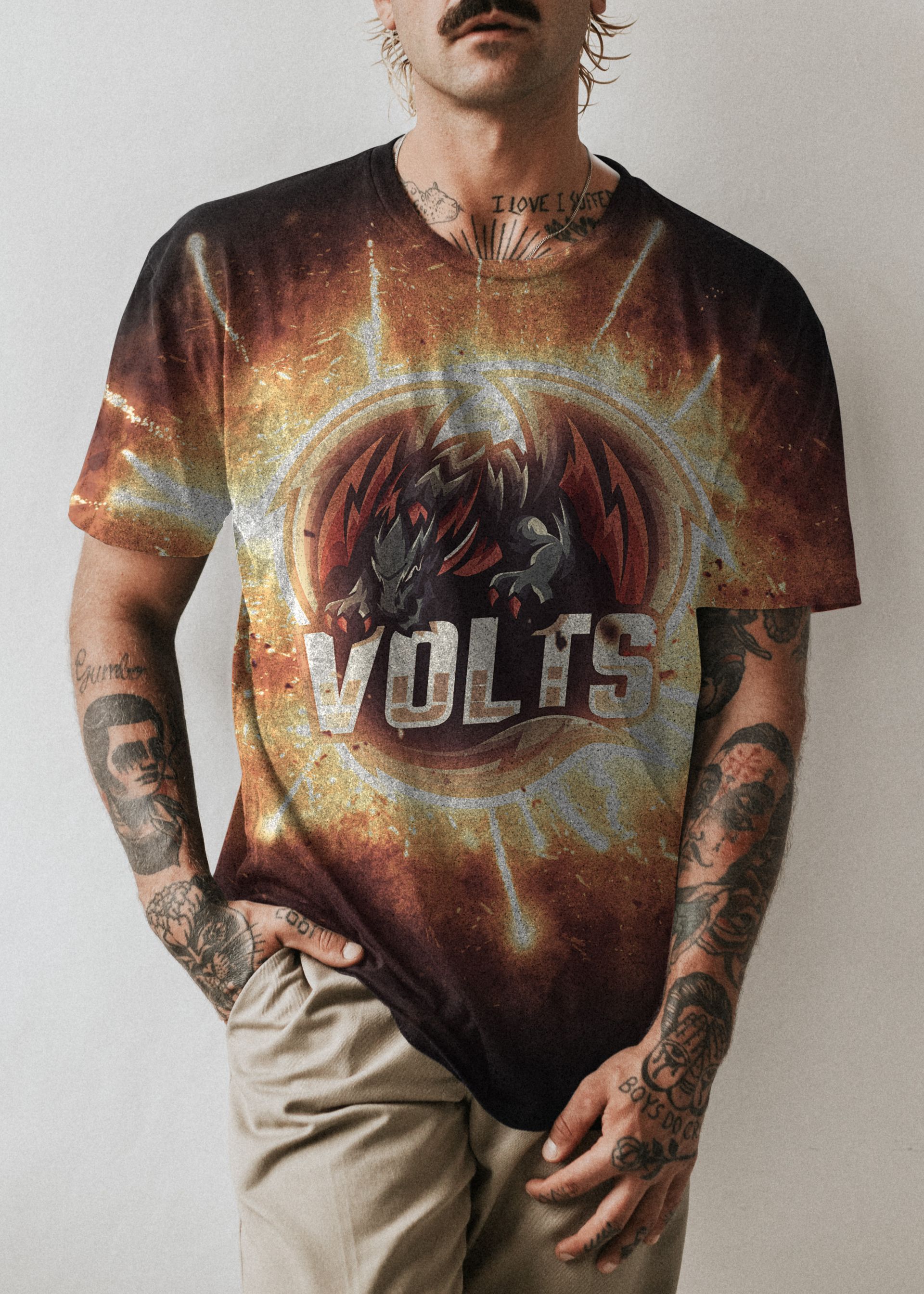 A man wearing a t-shirt with the word volts on it