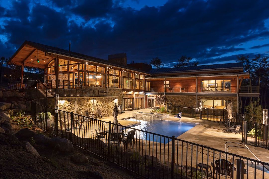 The Aspen House clubhouse at night from the back