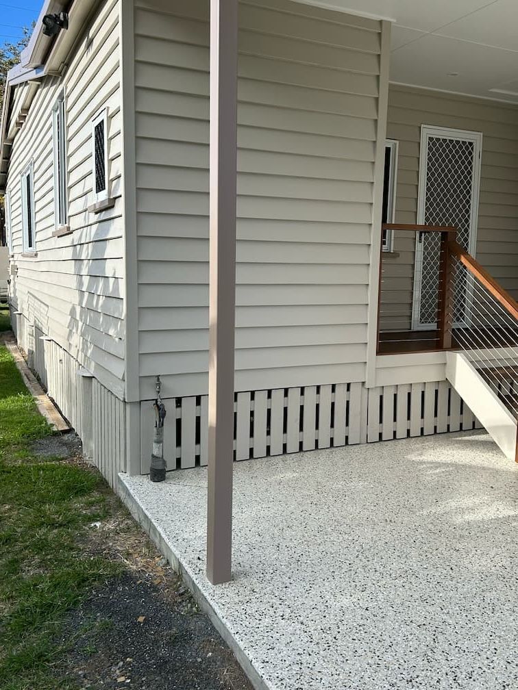A house with a porch and stairs on the side of it — Building Services in Rockhampton
