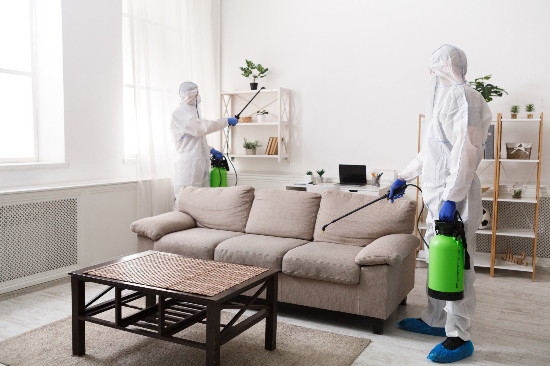Men In Protective Suit Spraying Pesticides — Cuba, MO — A & A Pest Control Technologies LLC. Men In Protective Suit Spraying Pesticides — Cuba, MO — A & A Pest Control Technologies LLC.