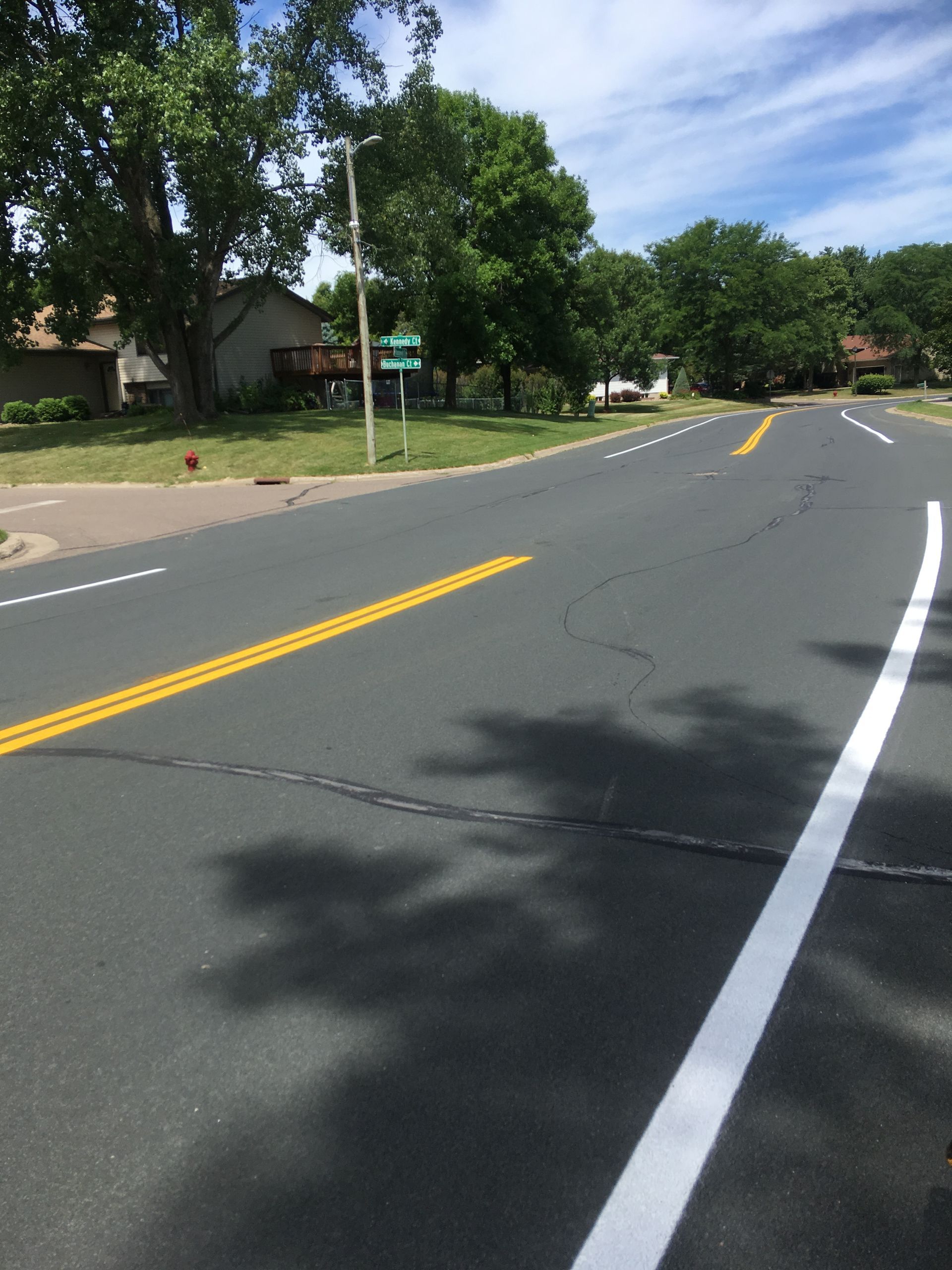 A Road with White Lines and Yellow Lines on It | Owatonna, MN | Seykora Striping