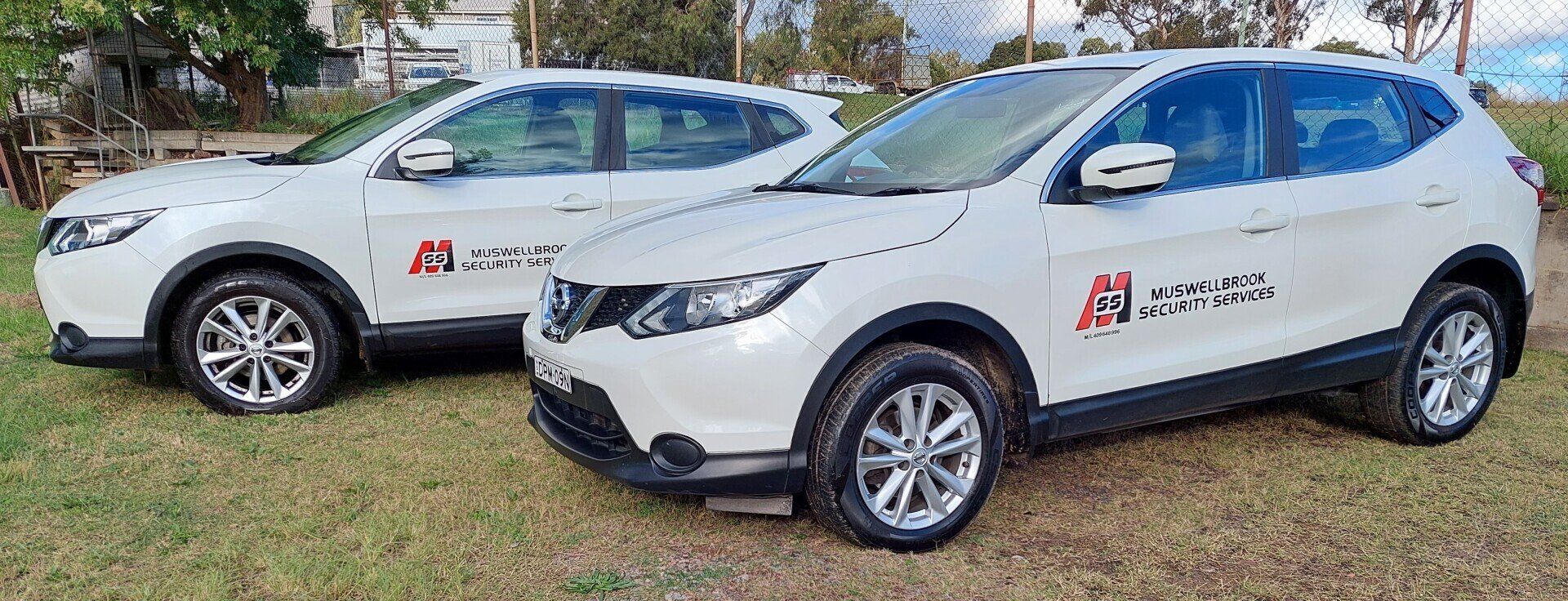 Security Officer Looking At Security Cameras — Security Systems in Muswellbrook, NSW