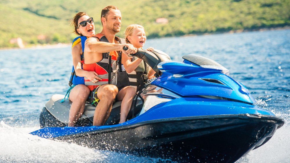 Happy Family Riding Jet Ski — Sylva, NC — Sylva Insurance Agency Happy Family Riding Jet Ski — Sylva, NC — Sylva Insurance Agency