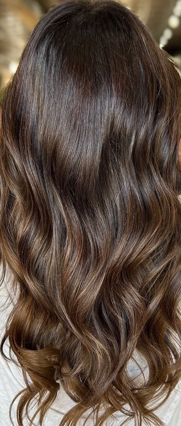 Dark brown wavy hair.