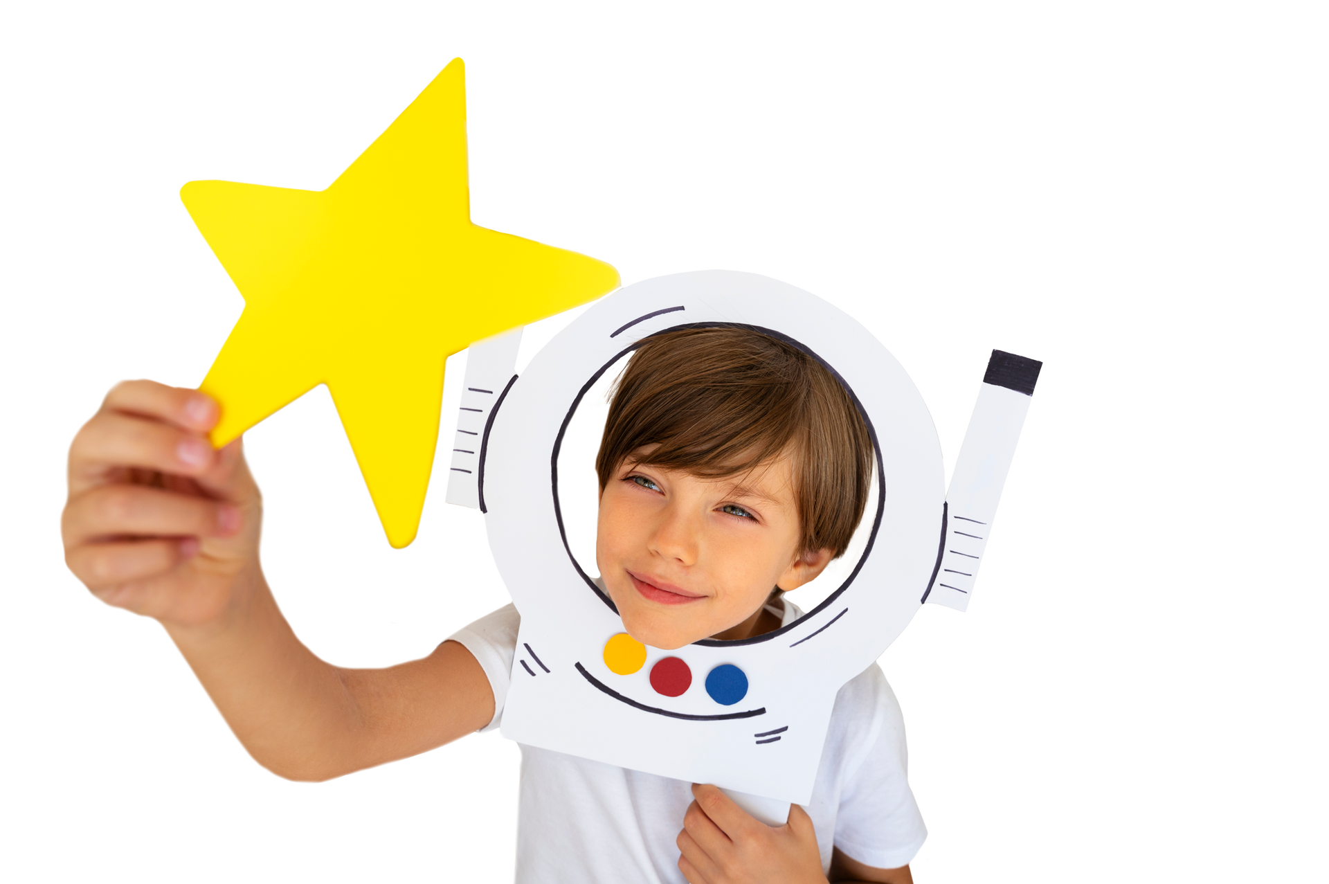 A young boy is holding a yellow star in front of his face.