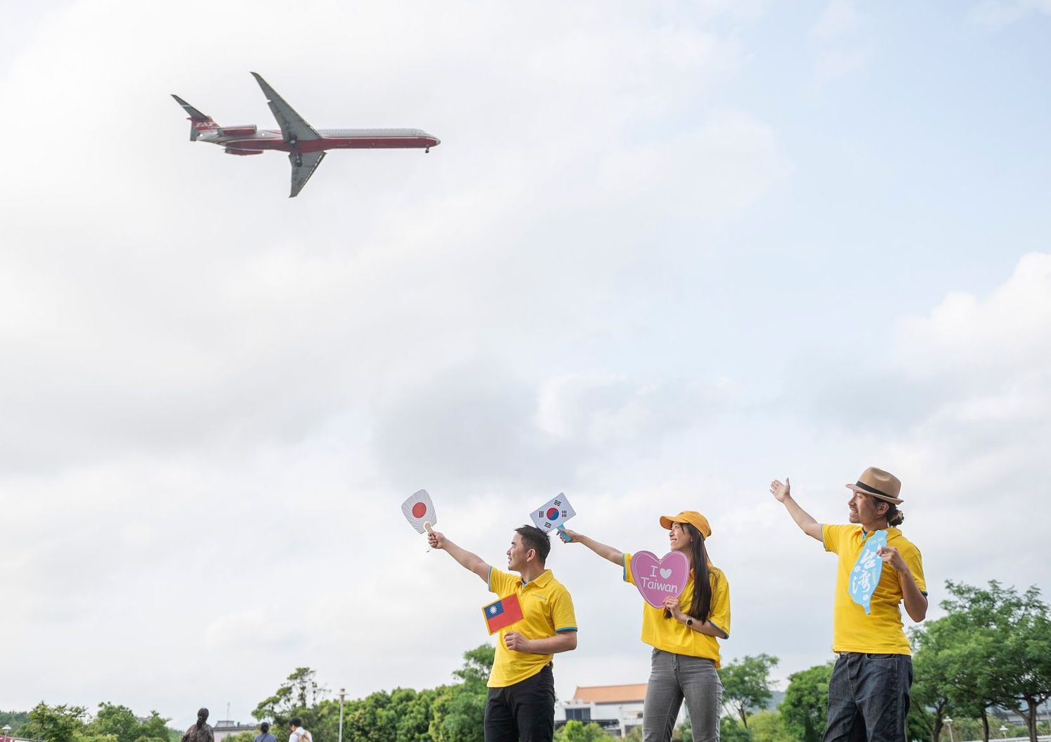 MyProGuide local guides welcoming travelers under an airplane in the sky
