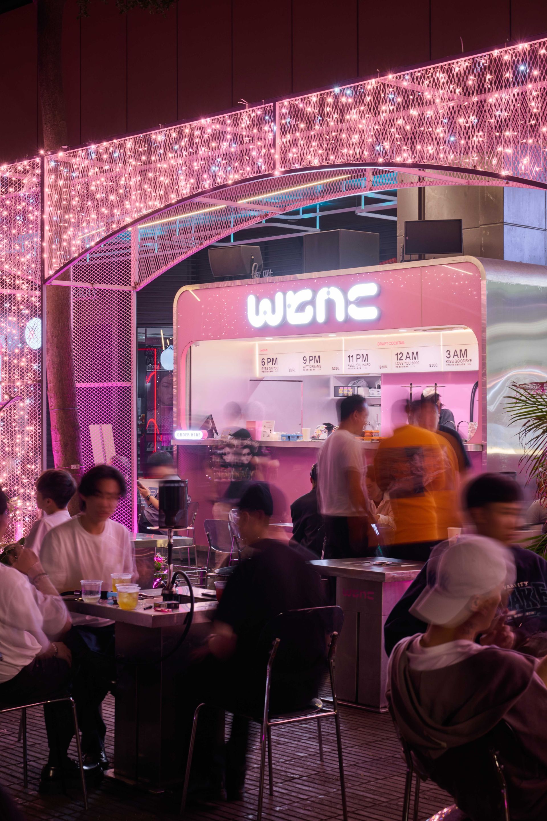 Guests drinking cocktails at a bar stop on the TipsyBuzz Night Sightseeing Buzz Tour in Taipei