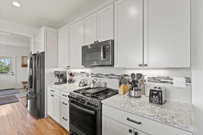 A kitchen with a large island in the middle of it.