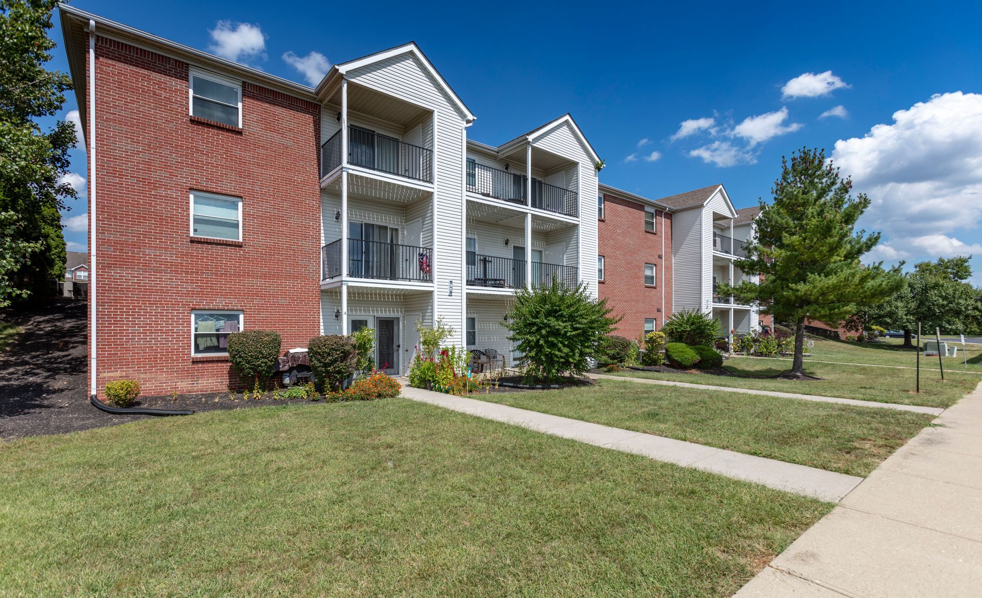 Brick apartment buildings with balconies at Bridgewater Crossing community