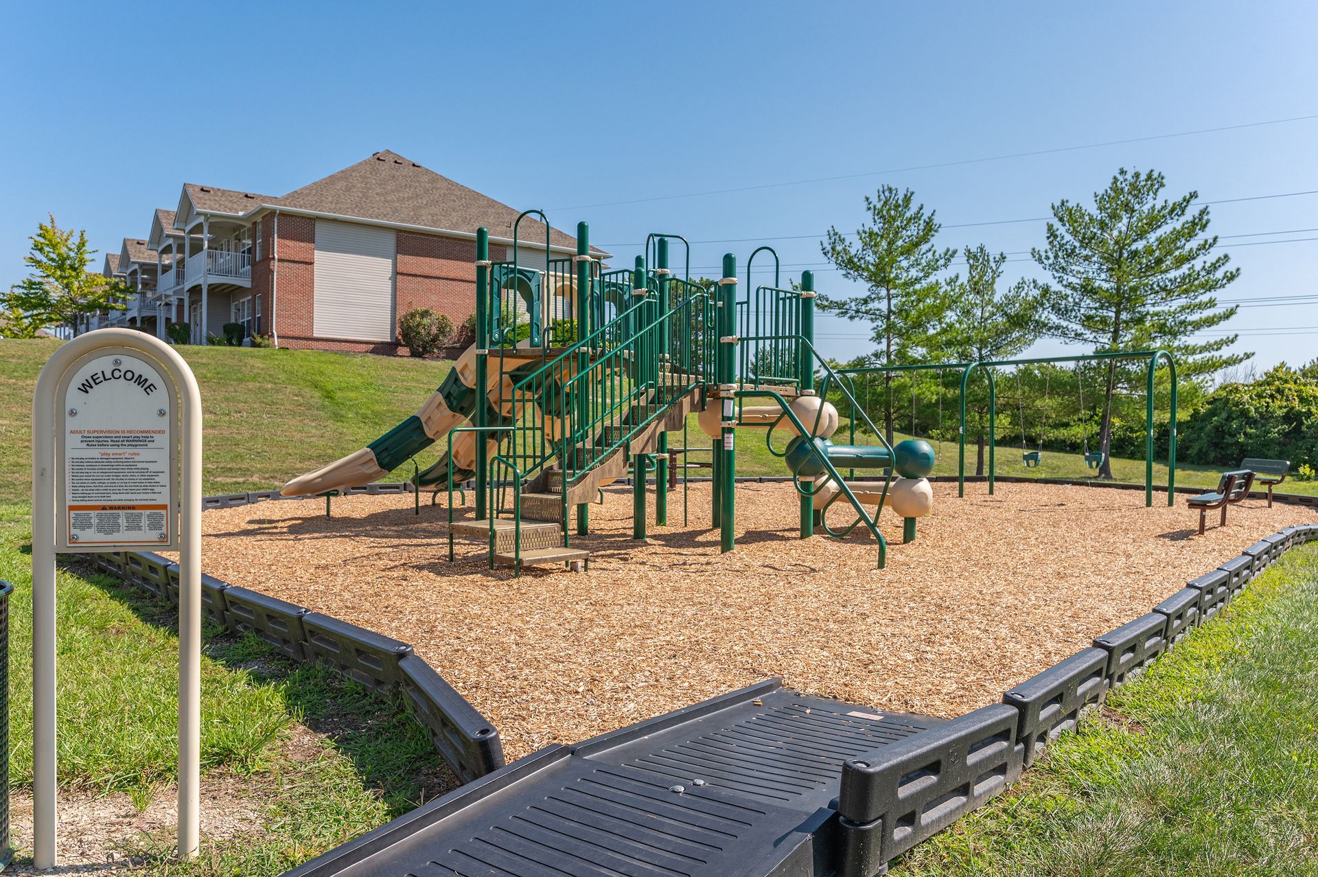 Playground with climbing structure and slide at Bridgewater Crossing