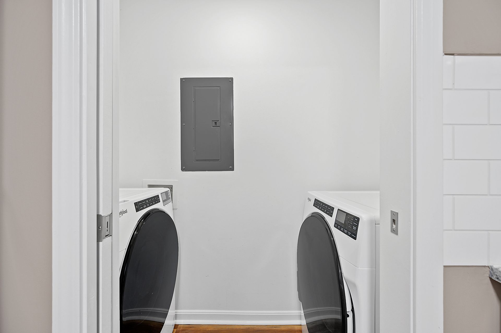a laundry room with two washers and dryers in it .