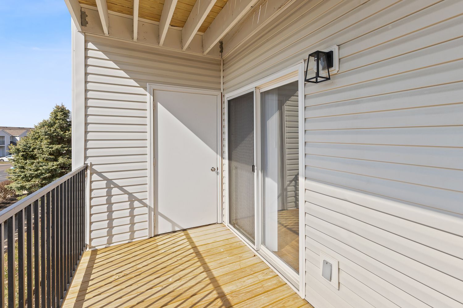 Private balcony with sliding glass door at Bridgewater Crossing apartment