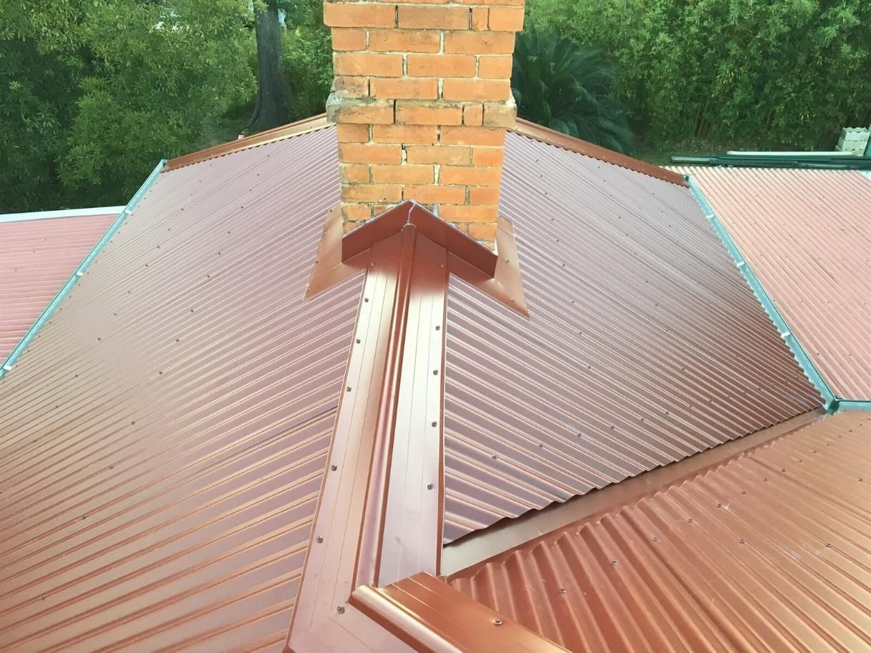A Roof With A Chimney On Top Of It — Mad About Metal Roofing & Guttering PTY LTD in Newcastle, NSW
