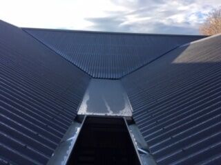 A Close up of a Roof with a Drain on it — Mad About Metal Roofing & Guttering PTY LTD in Newcastle, NSW