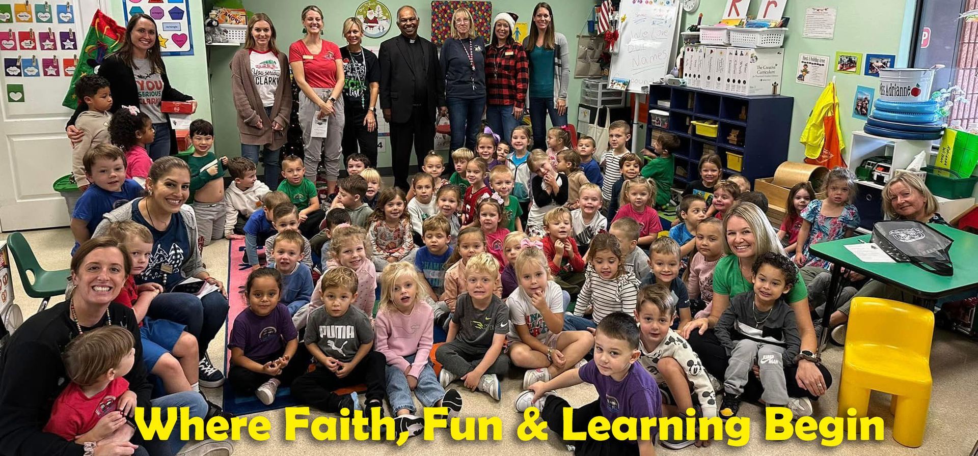Large classroom group photo with children, teachers, and festive decorations; text reads “Where Faith, Fun & Learning Begin”