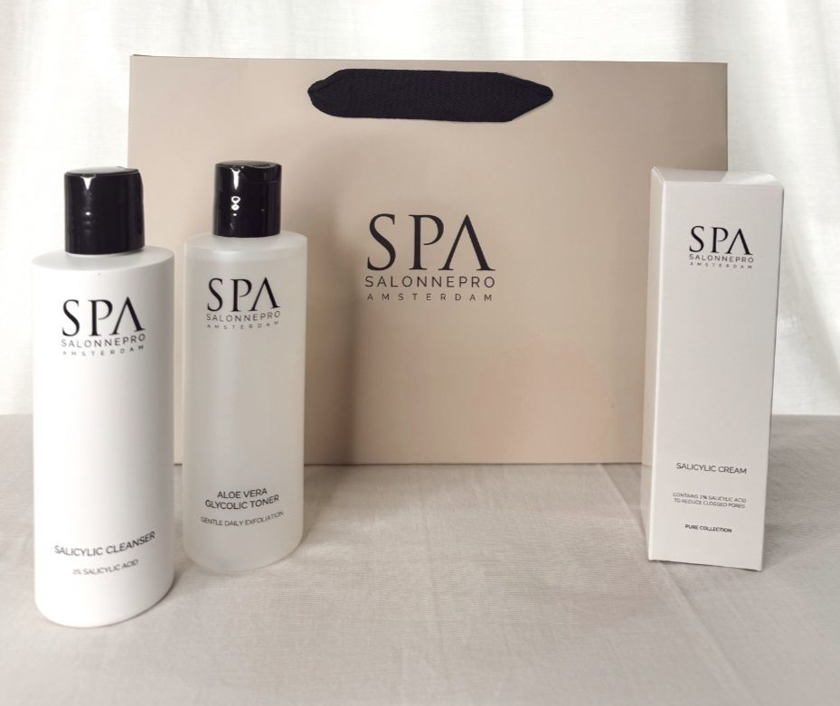 Spa skincare bottles and a box on a beige background