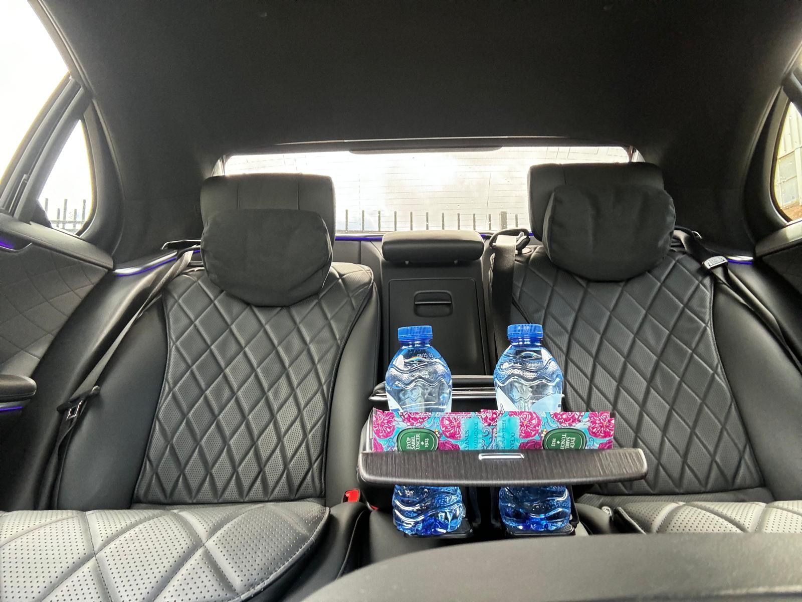 Chauffeur Service Amsterdam ADT Taxi Amsterdam with a Mercedes E class Black color infront of the central station