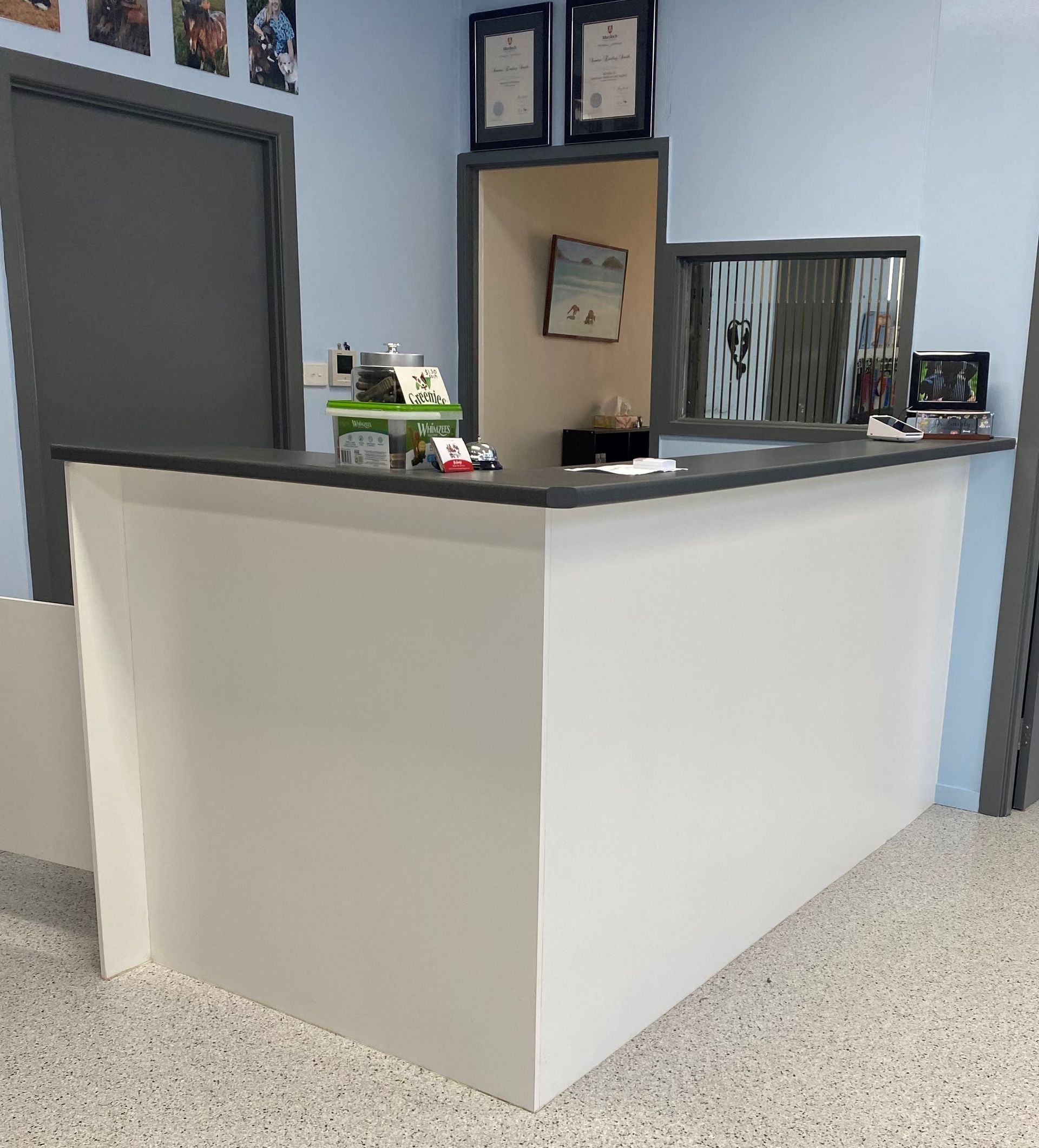Empty Reception Desk With White Front, Dark Countertop, and Office — Valley Cabinetmakers Pty Ltd In Biloela, QLD