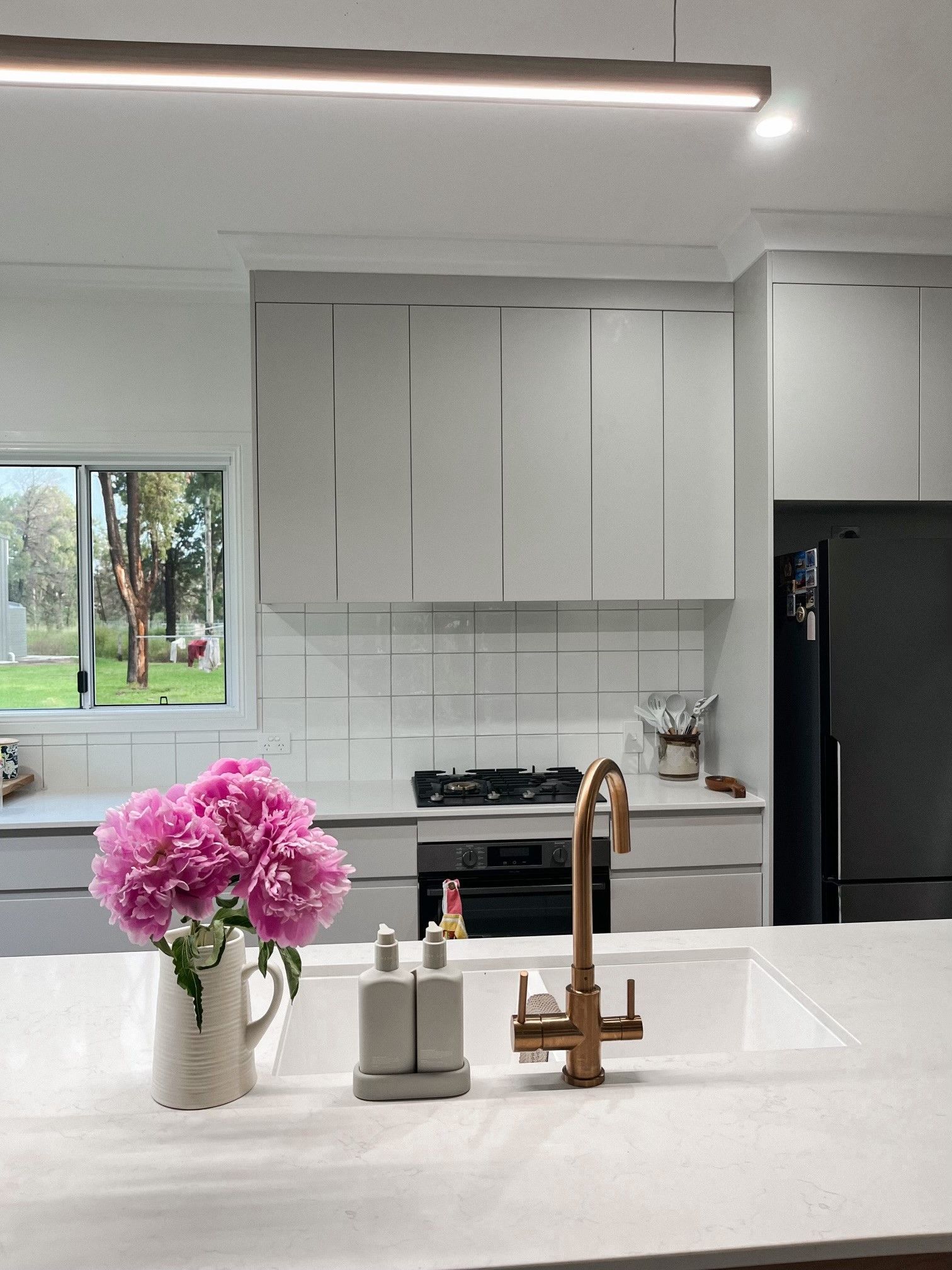 Modern Kitchen With Pink Peonies, Gold Faucet, Grey Cabinets — Valley Cabinetmakers Pty Ltd In Biloela, QLD