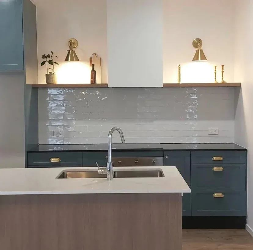 Modern Kitchen with Teal Cabinets, Light Backsplash, and Two Brass Sconces — Valley Cabinetmakers Pty Ltd In Biloela, QLD 