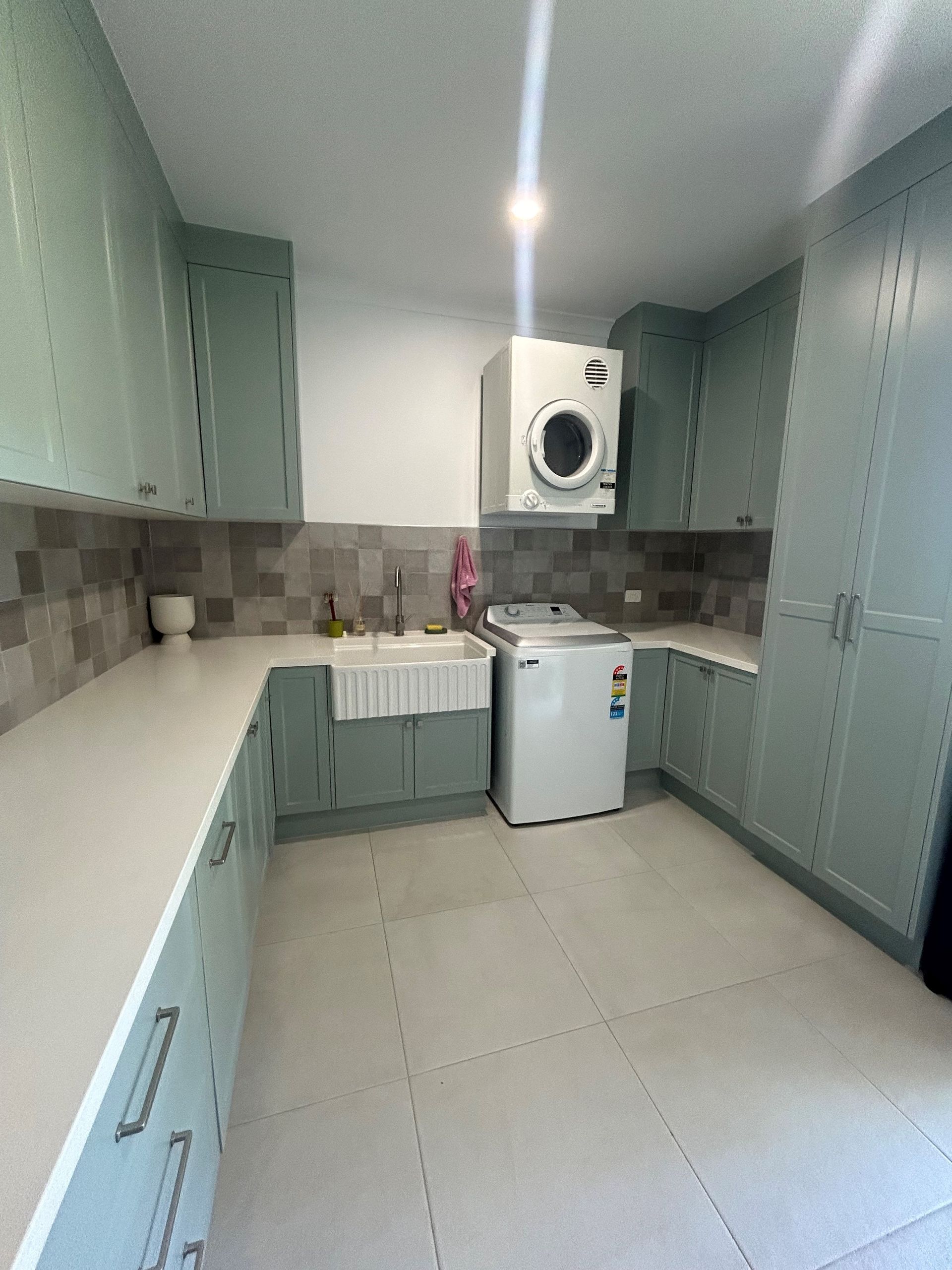 Modern White and Green Laundry Room With Washer — Valley Cabinetmakers Pty Ltd In Biloela, QLD