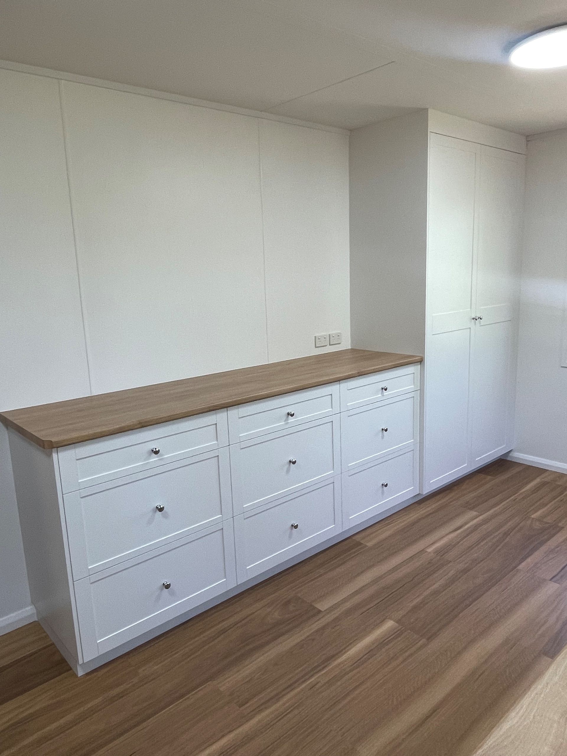 White Dresser With Wooden Top Against a Wall — Valley Cabinetmakers Pty Ltd In Biloela, QLD