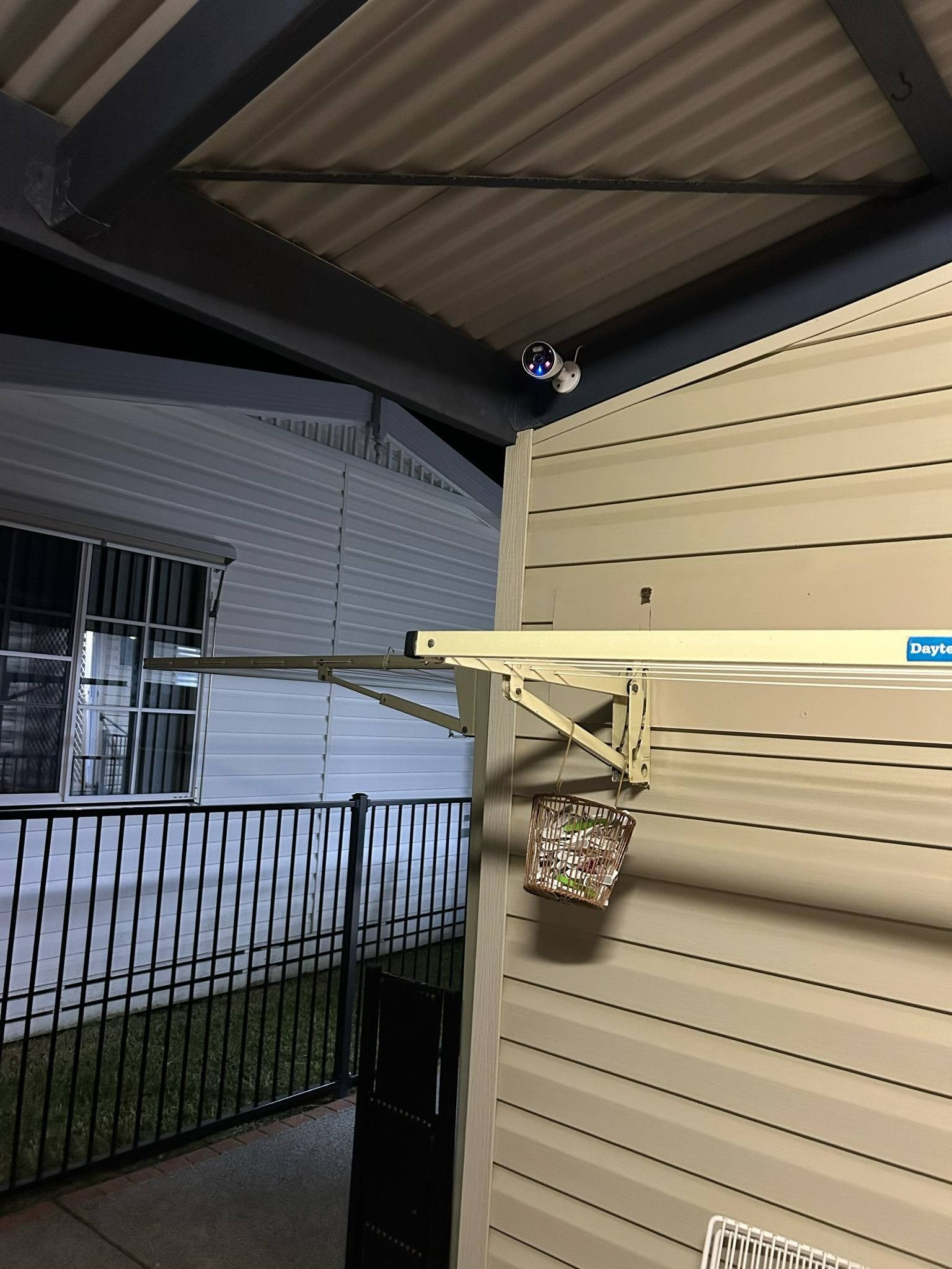 Outdoor Security Camera on a Light Beige House Wall — Wetzel Electrical in Shellharbour, NSW