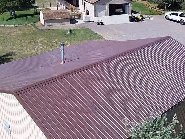 A close up of a blue metal roof