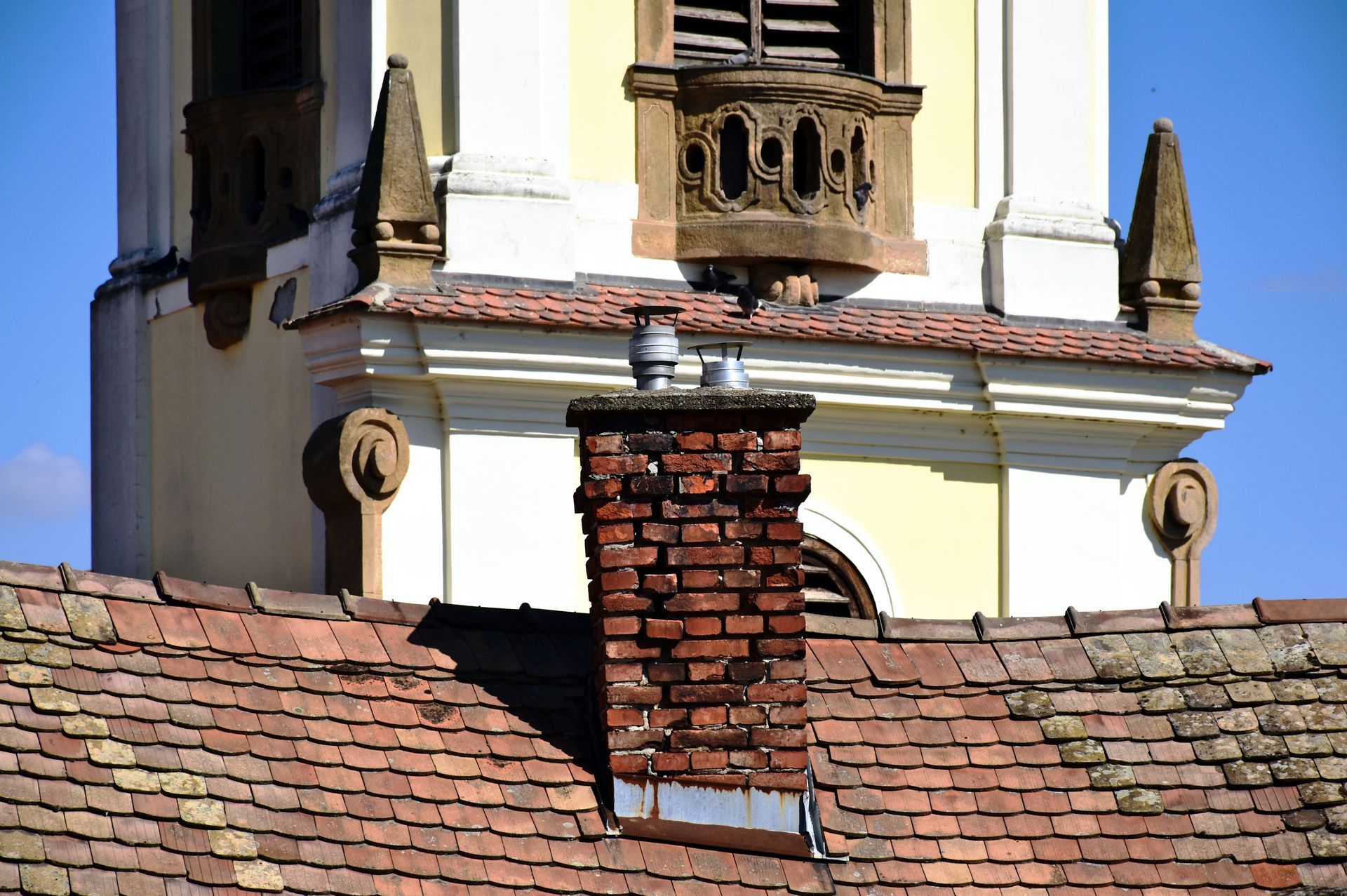 A roof with a skylight in the middle of it