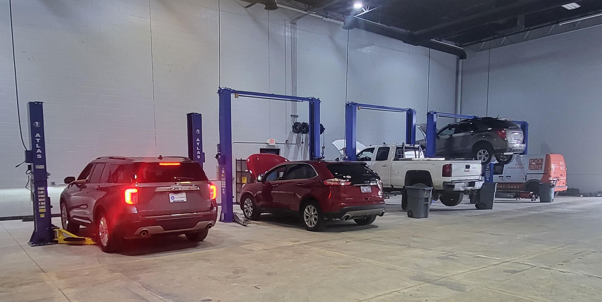 Photo of five cars in the shop's garage | Northline Auto Repair