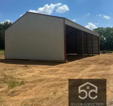 Large metal building under construction with the