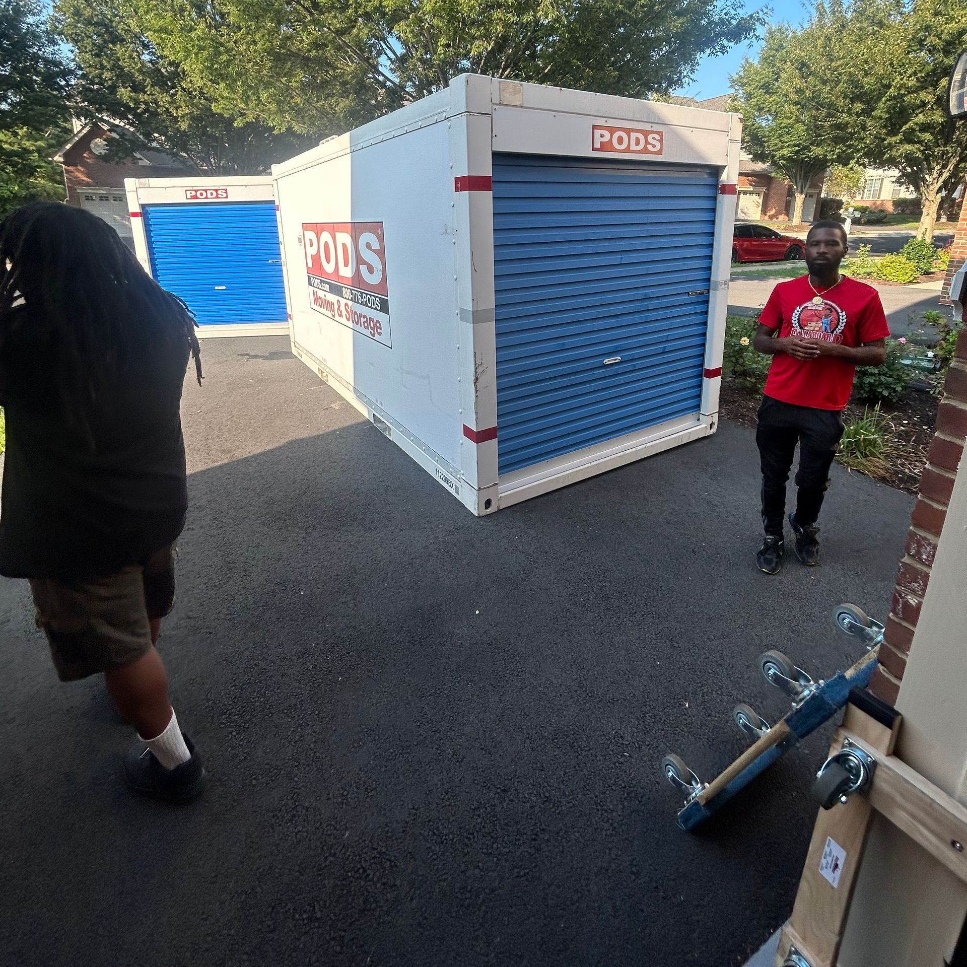 A man standing in front of a pods storage unit