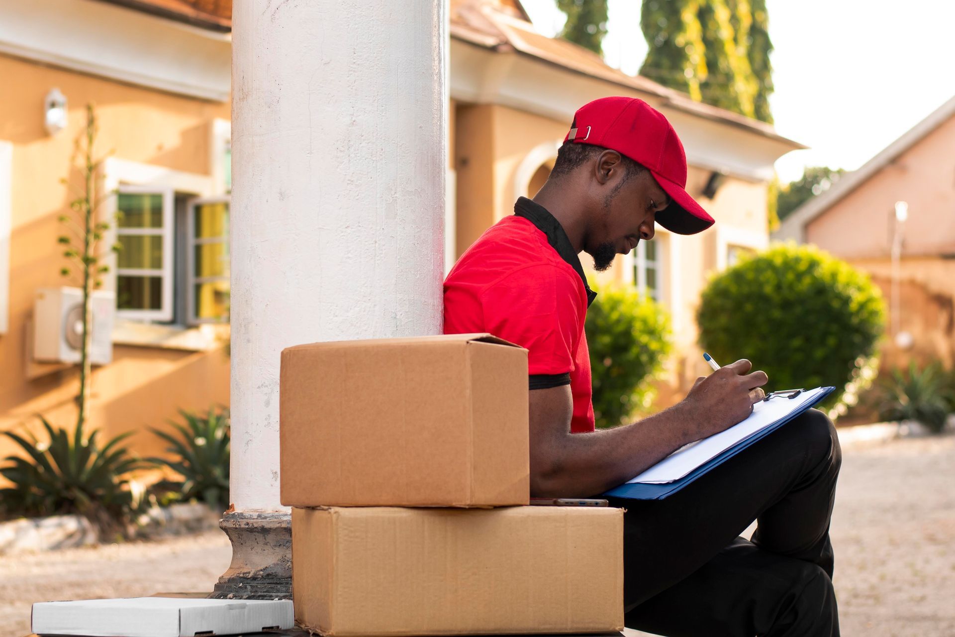 A red shirt that says All Aboard Movers on it