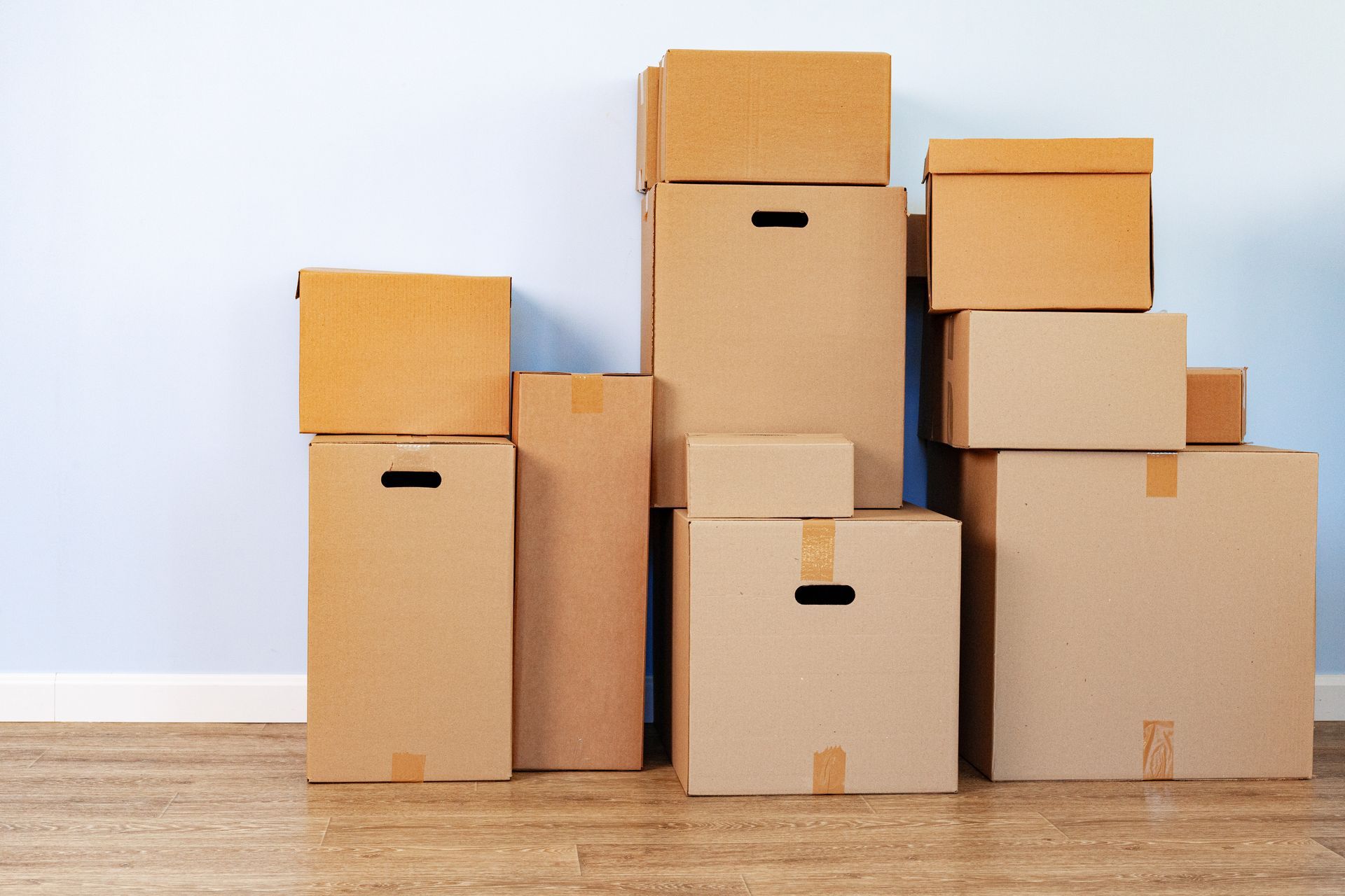 A bunch of cardboard boxes are stacked on top of each other