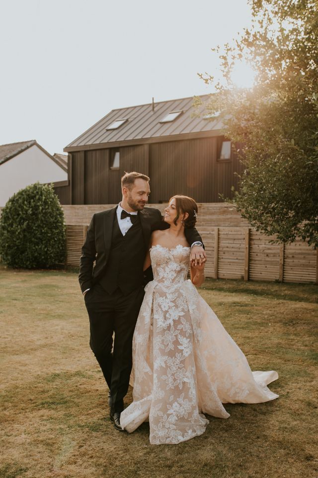 brida and groom walking together during golden hour at larkspur loge wedding venue