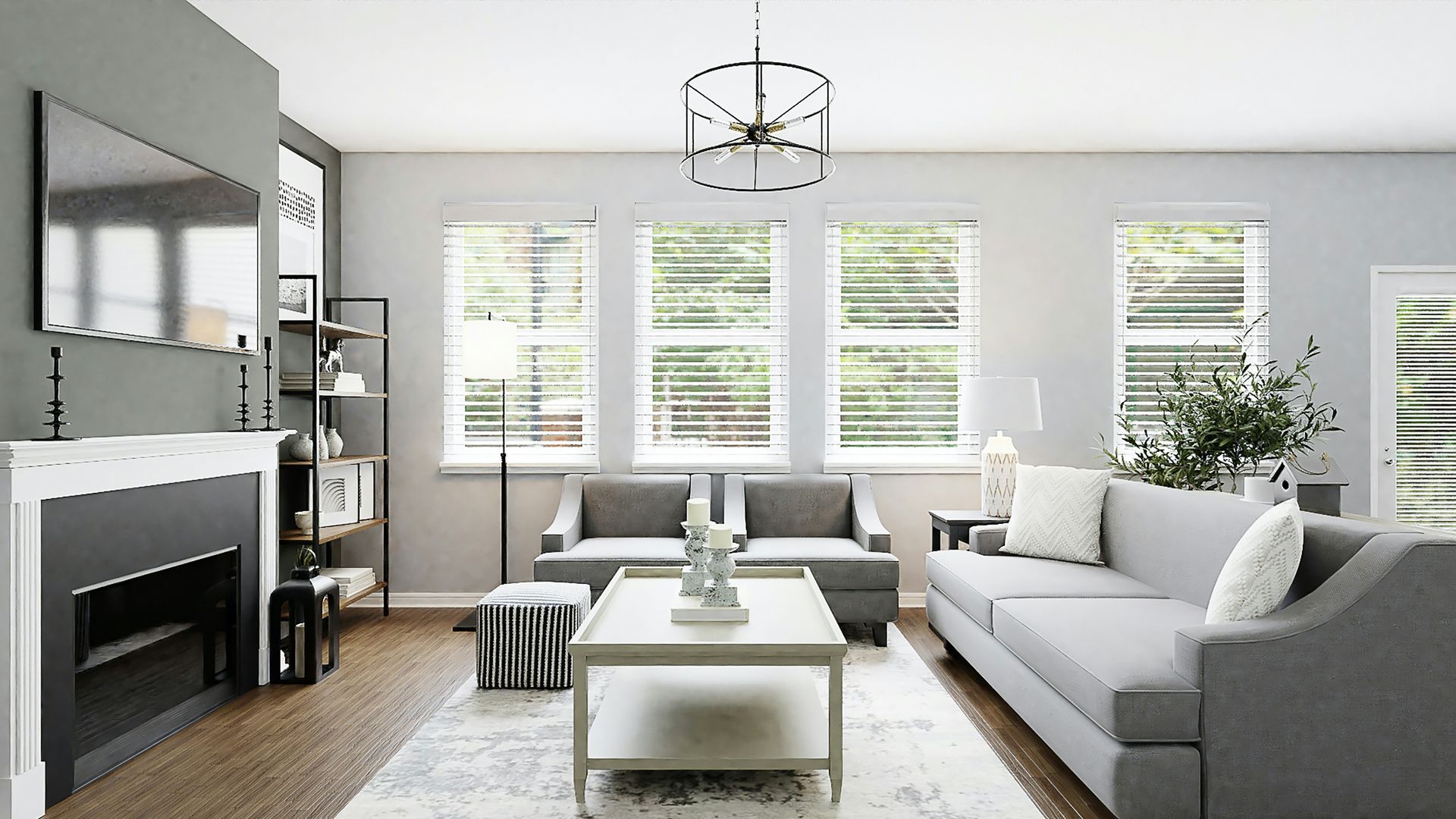 Modern living room with a gray sofa, fireplace, central coffee table, and large windows with white horizontal blinds.