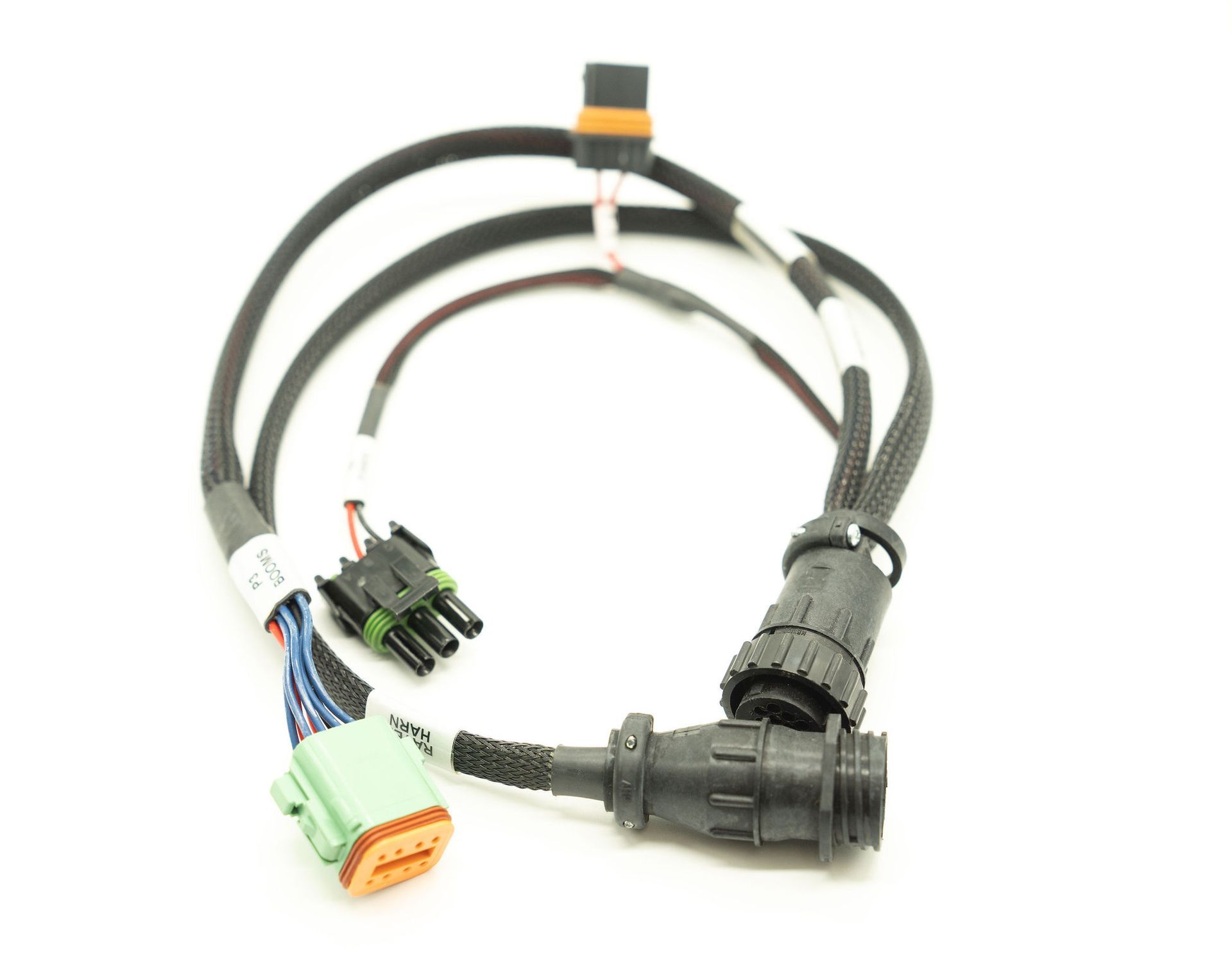 A close up of a cable with connectors on a white background
