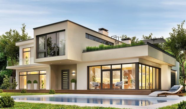 A modern house with a swimming pool in the backyard.