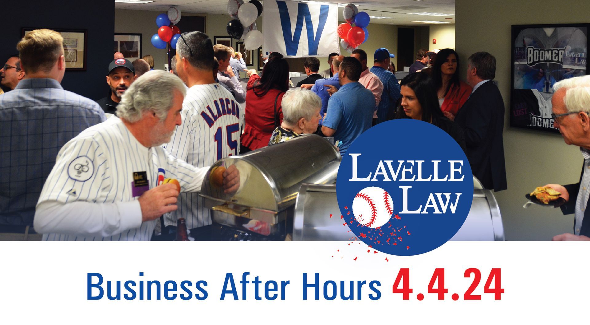 A group of people are gathered in a room with a sign that says lavelle law