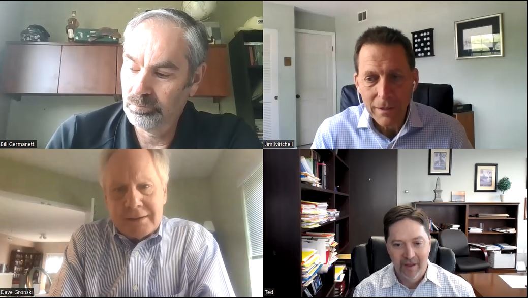 A group of men are having a video call.