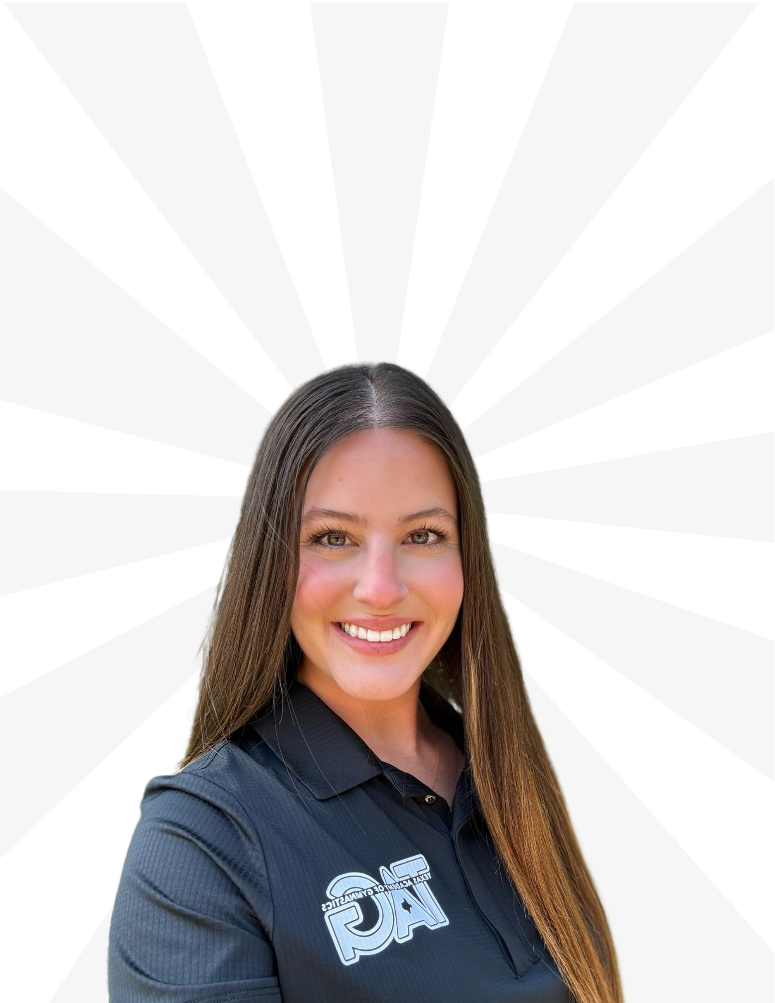 A person smiling, wearing a black collared polo shirt with a graphic logo, against a light gray sunburst background.