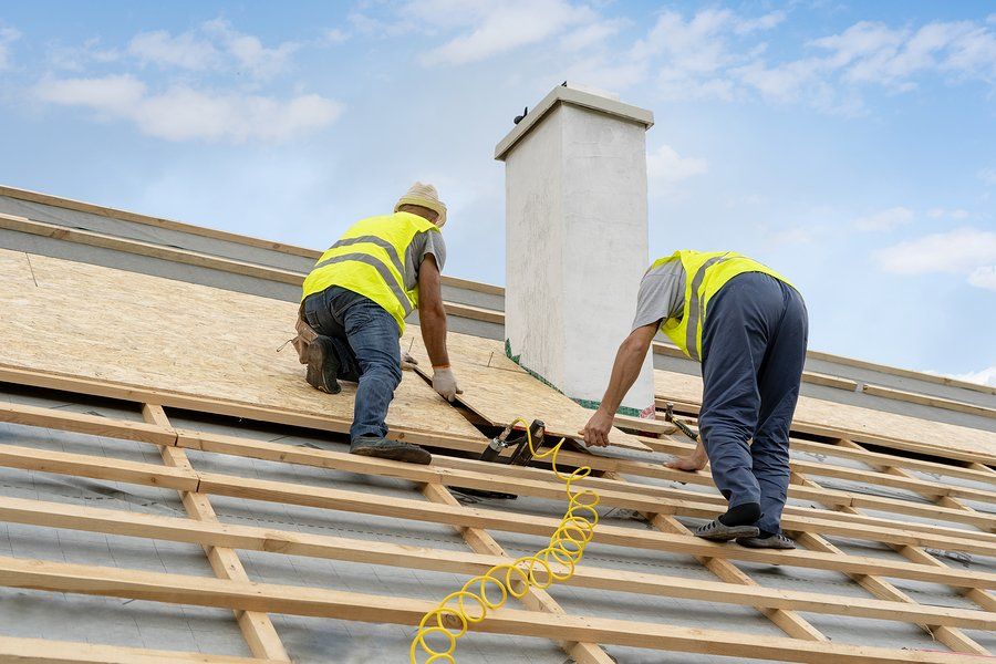 two workers installing the wood