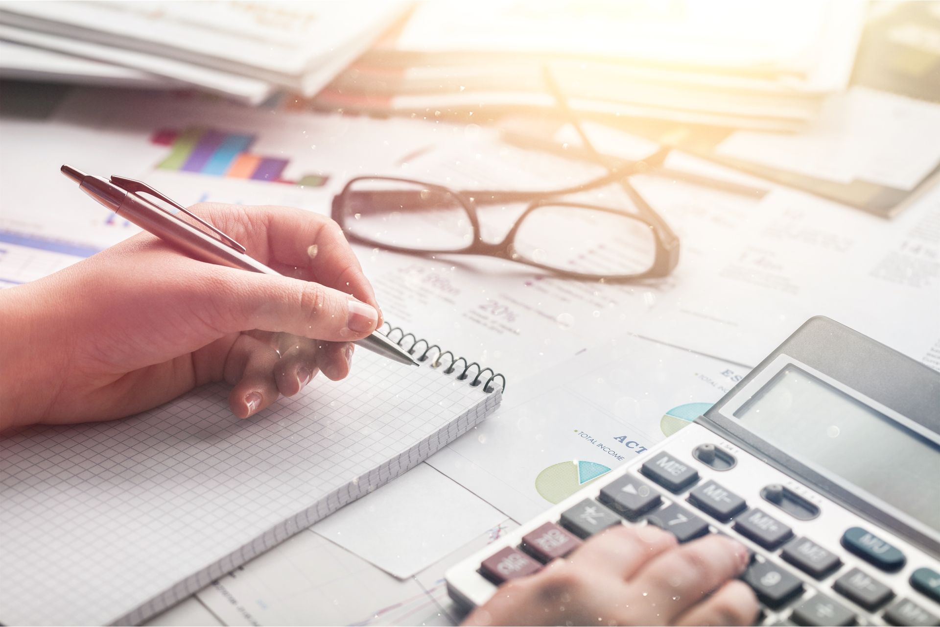 Property tax appeal attorney analyzing financial charts and data for assessment reduction.