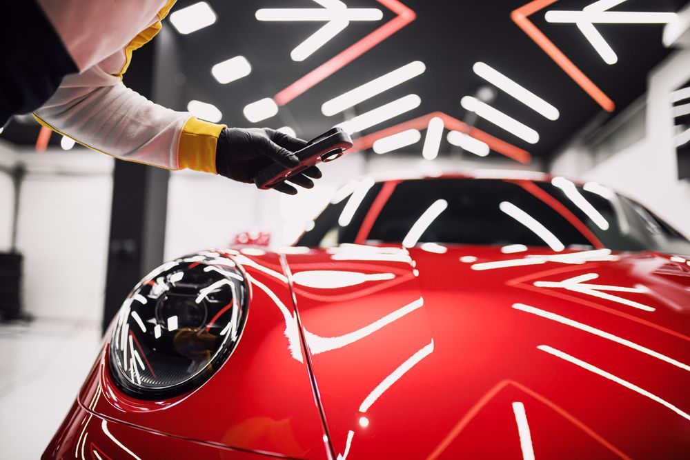 Person in Black Gloves Measuring — Elite Fleet Auto - Electrics & Mechanical in Cannonvale, QLD